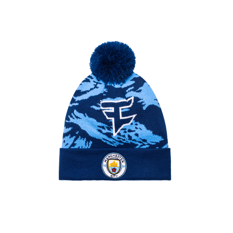 Manchester City Faze clan Collaboration Camo Knit Beanie with a Blue Beanie and a Manchester City Logo on the front