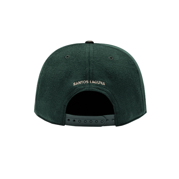 Santos Laguna Prep Snapback Hat with structured high 6-panel crown in melton wool, flat peak PU leather brim, front embroidered wool backed applique patch with merrowed edges, back embroidered club name, in green and brown.